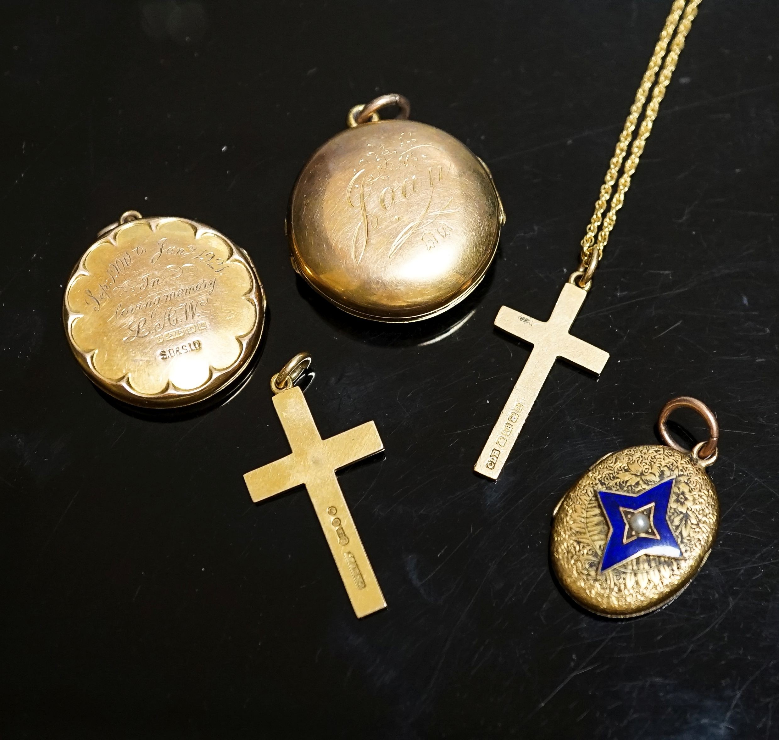 A group of small lockets and an 18ct cross pendant, 3.2 grams and a 15ct cross pendant, 3.6 grams.